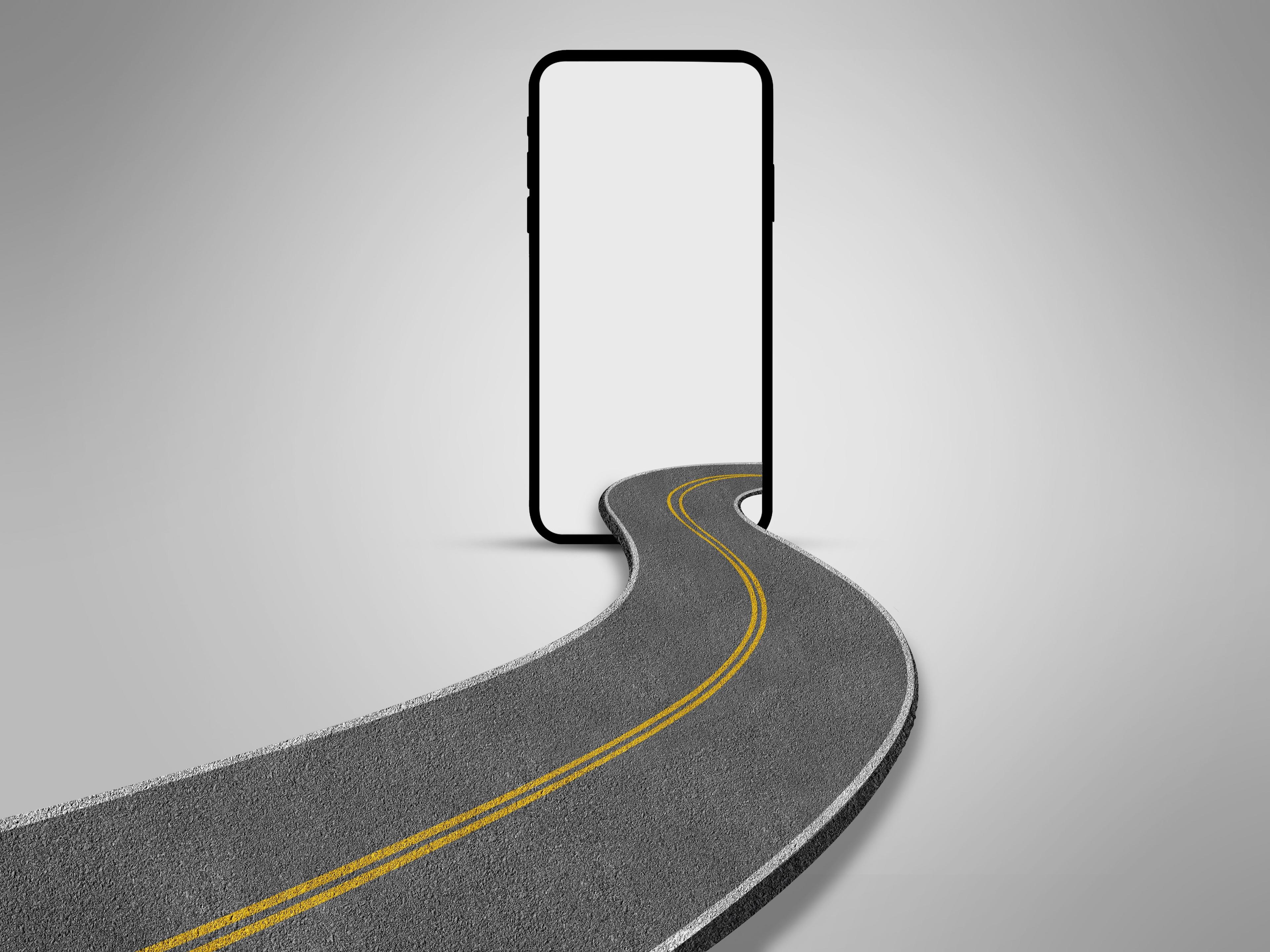 A curved road with yellow lines merging into a blank smartphone screen against a gray background