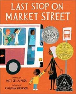Children's book cover showing diverse characters at a bus stop with award medals, illustrated in a vibrant retro style with orange background