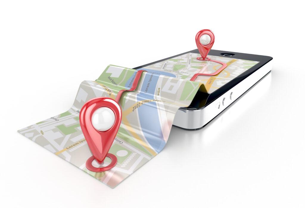 3D illustration of a smartphone displaying a map with red location pins, with the map appearing to fold out from the screen